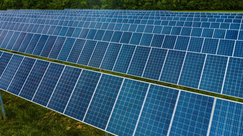 A vibrant solar farm showcasing rows of photovoltaic panels capturing energy.